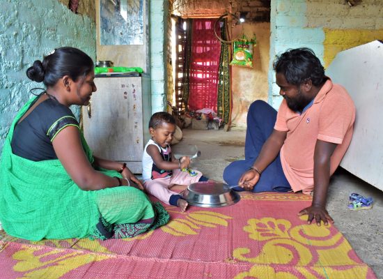 parents playing with baby